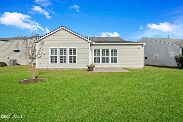 back of house featuring a patio area, a lawn, and central air condition unit