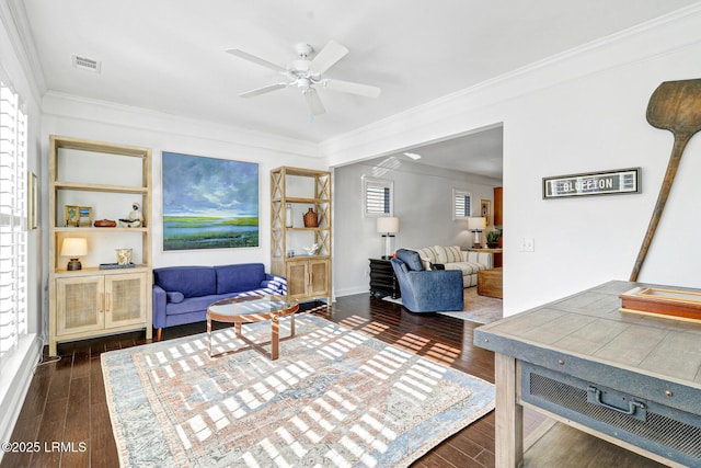 living room with ornamental molding, ceiling fan, and dark hardwood / wood-style flooring