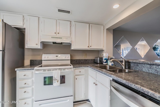 kitchen with under cabinet range hood, stainless steel appliances, a sink, and white cabinetry