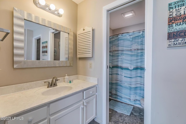 full bath with vanity, curtained shower, and toilet