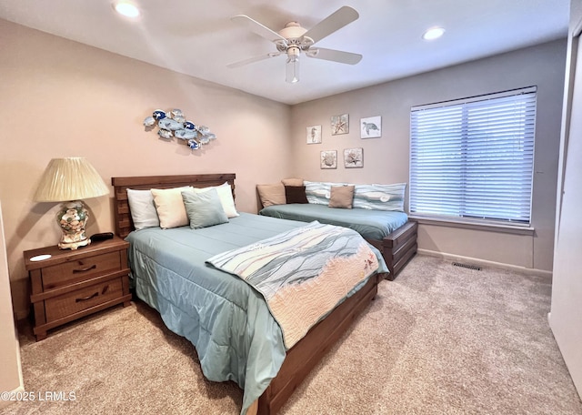 carpeted bedroom featuring baseboards, recessed lighting, and ceiling fan