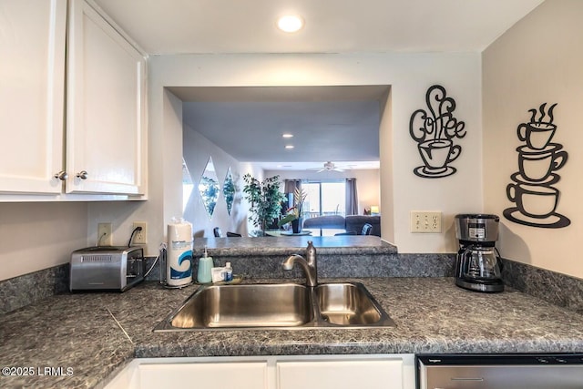 kitchen with white cabinets, dishwasher, a sink, ceiling fan, and recessed lighting