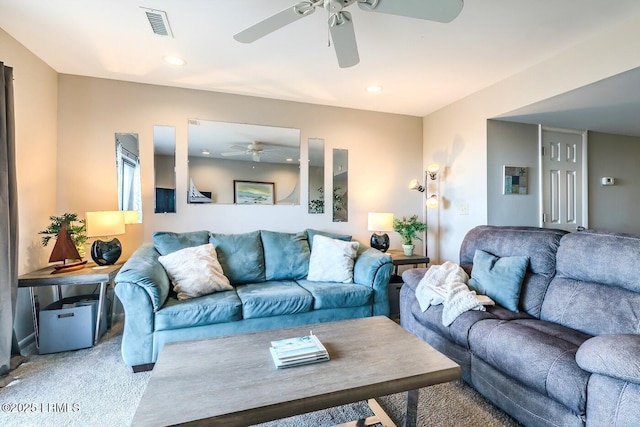 living room with light colored carpet, ceiling fan, and recessed lighting
