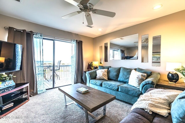 carpeted living room featuring a ceiling fan, healthy amount of natural light, and recessed lighting