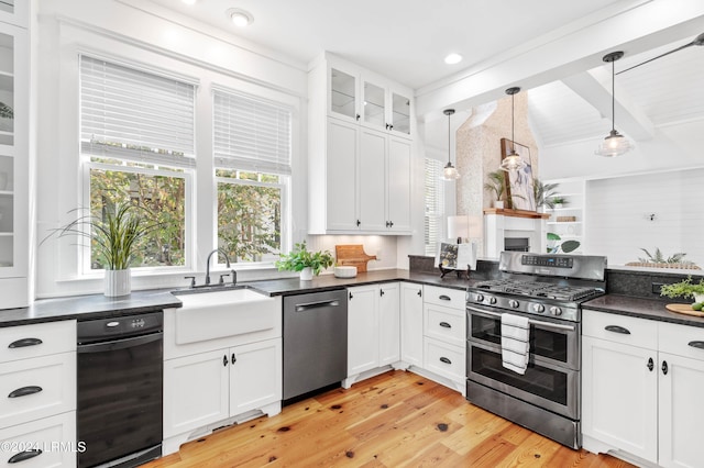 kitchen featuring white cabinetry, decorative light fixtures, beamed ceiling, and appliances with stainless steel finishes