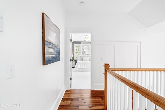 corridor featuring lofted ceiling and wood-type flooring