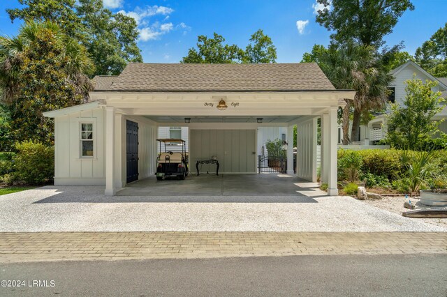 garage featuring a carport