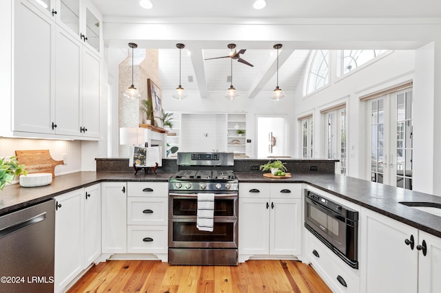 kitchen featuring pendant lighting, white cabinets, light hardwood / wood-style floors, kitchen peninsula, and stainless steel appliances