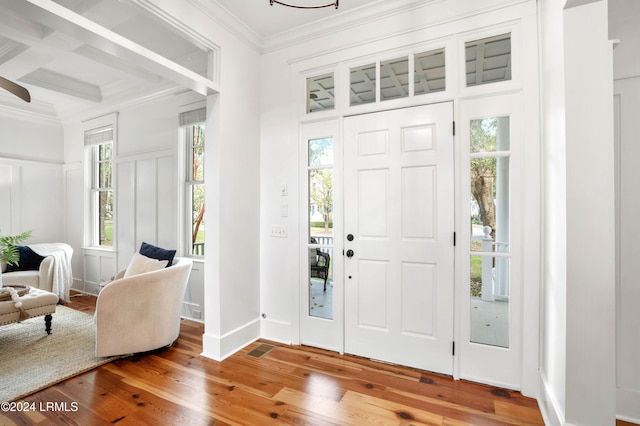 foyer entrance with hardwood / wood-style flooring and beamed ceiling