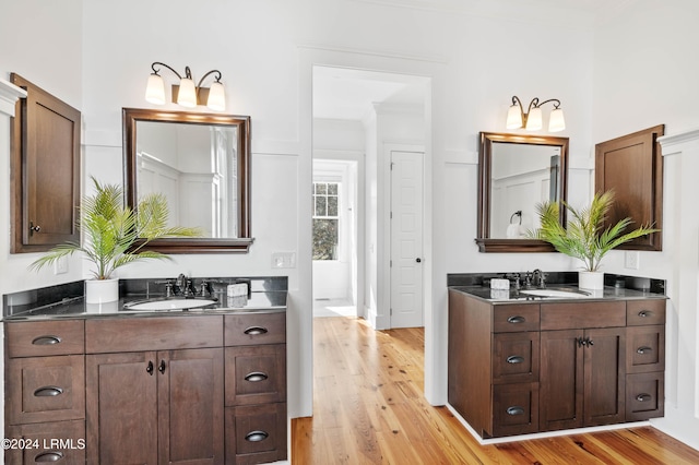 bathroom featuring vanity and hardwood / wood-style floors