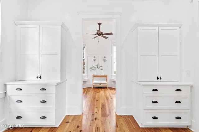 interior space with ceiling fan and light hardwood / wood-style floors