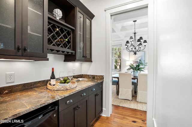 bar featuring beam ceiling, dark brown cabinets, coffered ceiling, light stone countertops, and light hardwood / wood-style floors