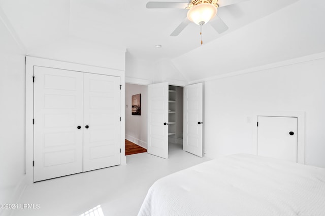 bedroom featuring lofted ceiling, a closet, and ceiling fan