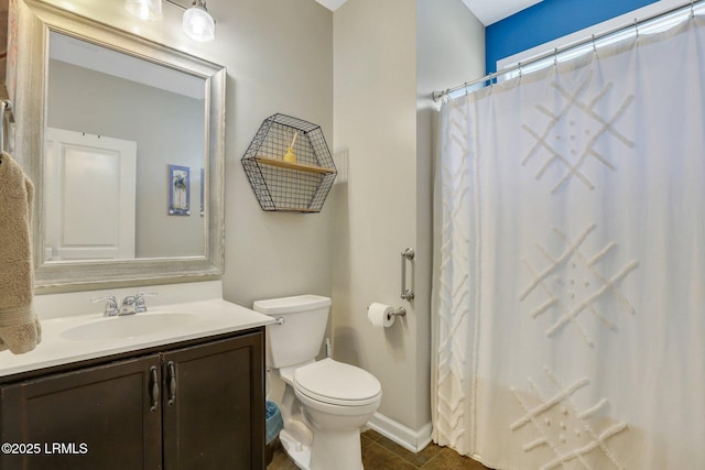 full bathroom featuring a shower with shower curtain, vanity, toilet, and tile patterned floors