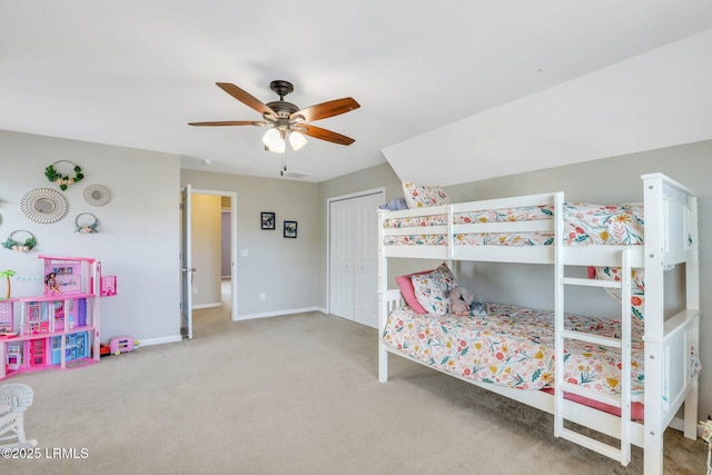 bedroom featuring carpet floors, a closet, ceiling fan, and baseboards