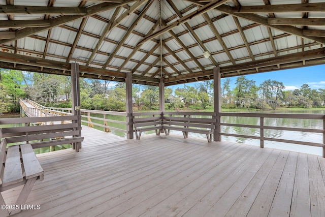 view of dock with a deck with water view and a gazebo