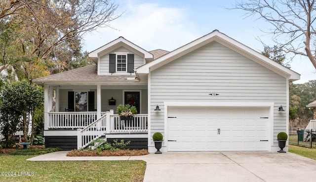 view of front facade with a garage and covered porch