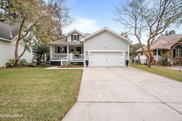 view of front of home featuring a porch, a garage, and a front yard