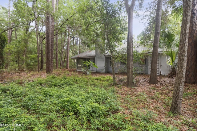 7 Stillwater Ct, Hilton Head Island, SC 29926 - view of yard with a sunroom