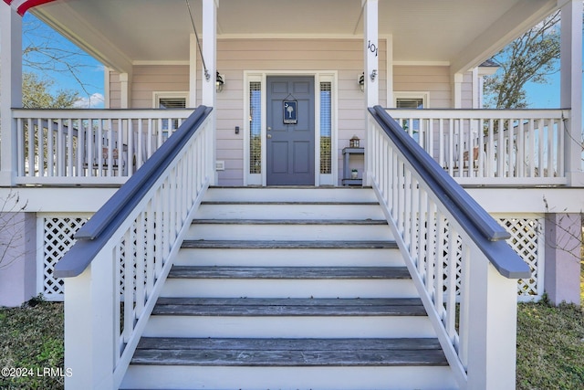 property entrance featuring covered porch