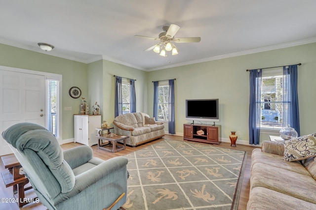 living room with wood-type flooring, ceiling fan, and crown molding