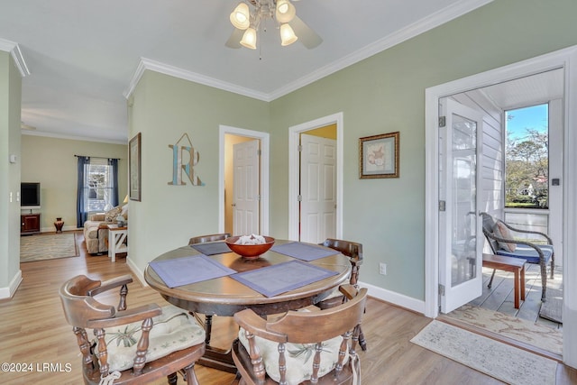 dining room featuring ornamental molding, ceiling fan, and light hardwood / wood-style flooring