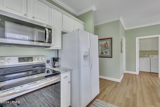 kitchen featuring white cabinetry, ornamental molding, stainless steel appliances, washer and clothes dryer, and light hardwood / wood-style floors