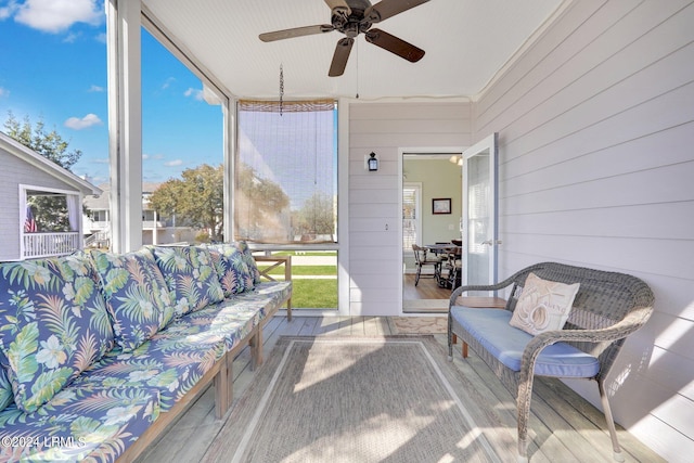 sunroom / solarium with ceiling fan