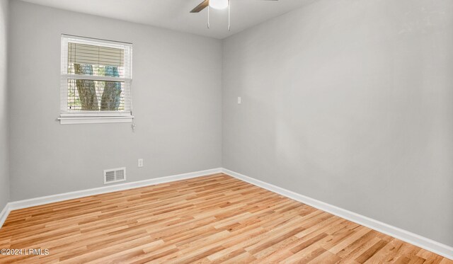 unfurnished room featuring ceiling fan and light wood-type flooring