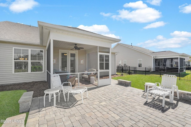 214 Lombards Mill Ln, Okatie, SC 29909 - view of patio / terrace featuring a sunroom, fence, a fire pit, and ceiling fan