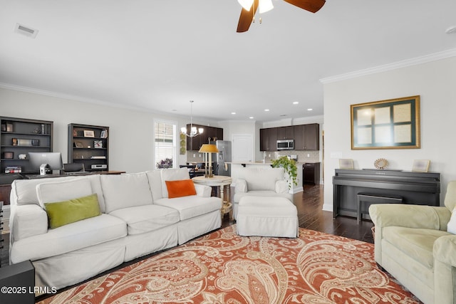 214 Lombards Mill Ln, Okatie, SC 29909 - living area featuring crown molding, dark wood finished floors, ceiling fan with notable chandelier, visible vents, and recessed lighting