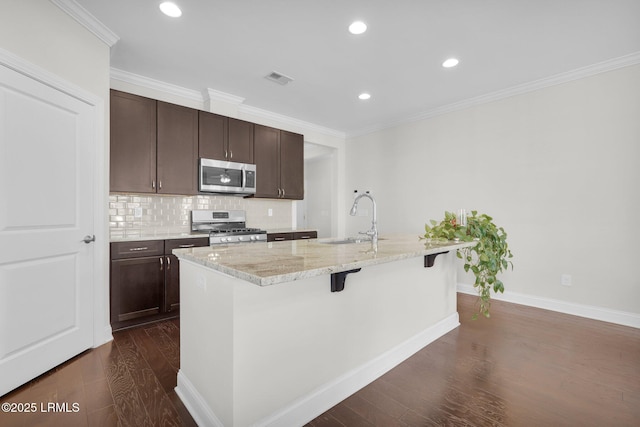 214 Lombards Mill Ln, Okatie, SC 29909 - kitchen featuring crown molding, a sink, appliances with stainless steel finishes, dark wood-style floors, and visible vents