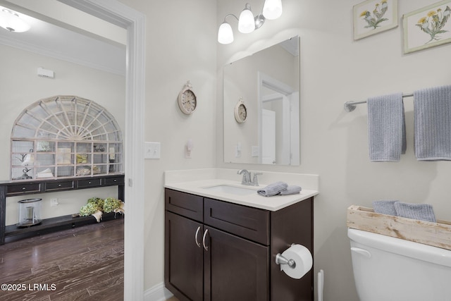 214 Lombards Mill Ln, Okatie, SC 29909 - half bath featuring wood finished floors, toilet, vanity, and ornamental molding