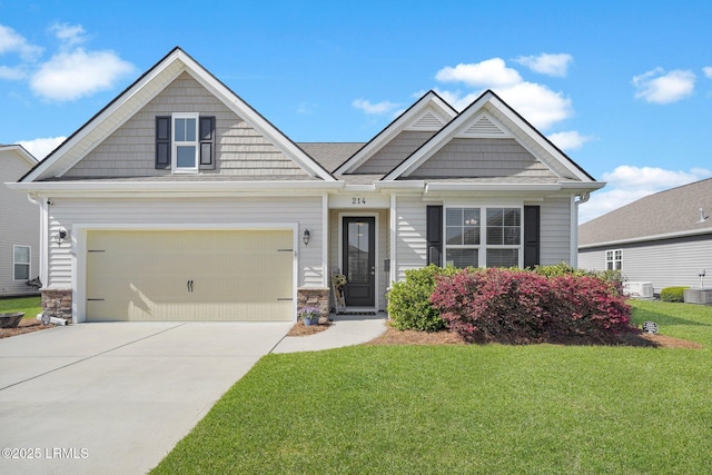 214 Lombards Mill Ln, Okatie, SC 29909 - craftsman-style home featuring stone siding, a garage, a front lawn, and concrete driveway