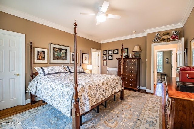 bedroom with wood-type flooring, crown molding, and ceiling fan