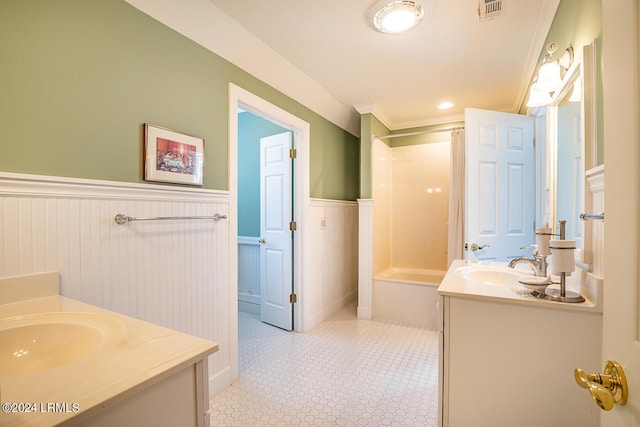 bathroom with vanity and crown molding