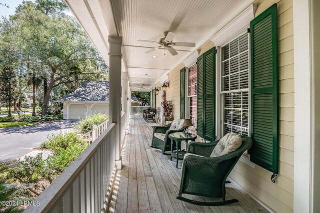 deck featuring ceiling fan and covered porch