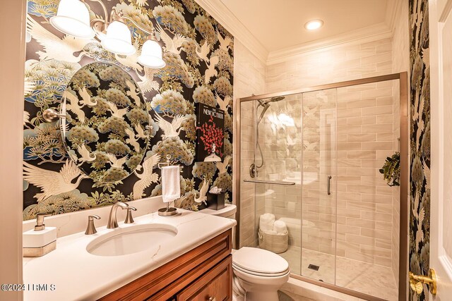 bathroom with crown molding, vanity, toilet, and an enclosed shower