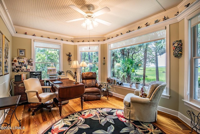 sitting room with crown molding, light hardwood / wood-style floors, and ceiling fan