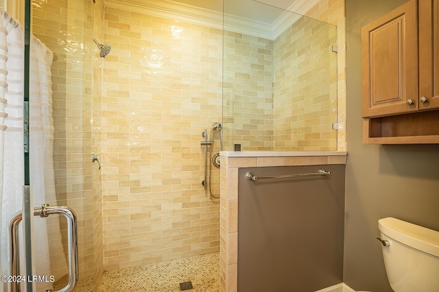 bathroom featuring ornamental molding, walk in shower, and toilet