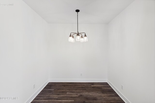 47 Silver St Unit 102, Ridgeland, SC 29936 - unfurnished room featuring a notable chandelier, baseboards, and dark wood-style flooring