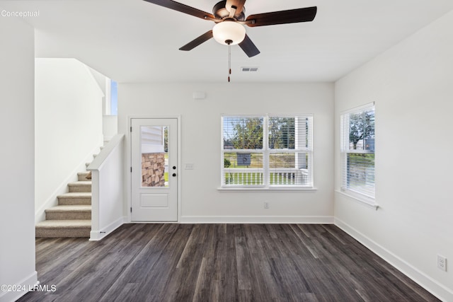 47 Silver St Unit 102, Ridgeland, SC 29936 - foyer entrance with dark wood finished floors, stairway, and baseboards