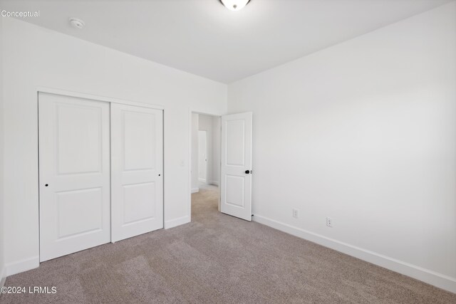 47 Silver St Unit 102, Ridgeland, SC 29936 - unfurnished bedroom with a closet, baseboards, and carpet flooring