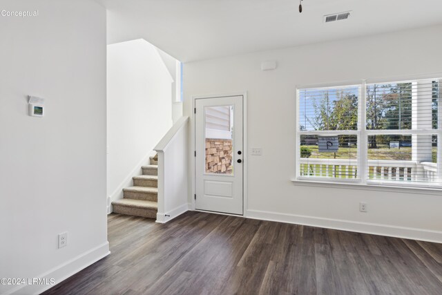 47 Silver St Unit 102, Ridgeland, SC 29936 - entryway with dark wood-type flooring, stairway, visible vents, and baseboards