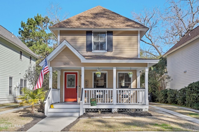 view of front of house featuring a porch and a shingled roof