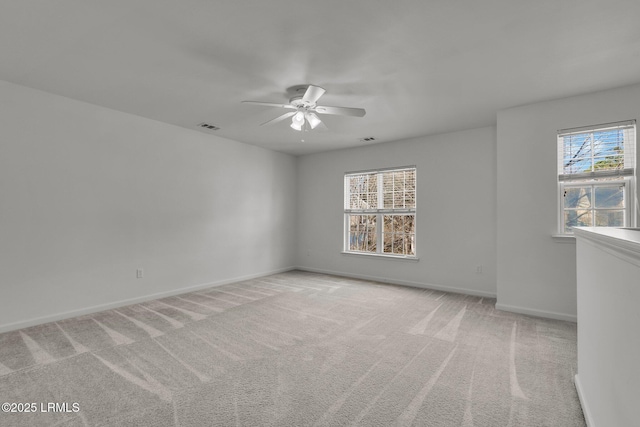 empty room with light carpet and ceiling fan