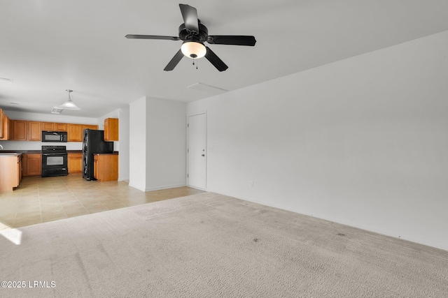 unfurnished living room featuring light colored carpet and ceiling fan