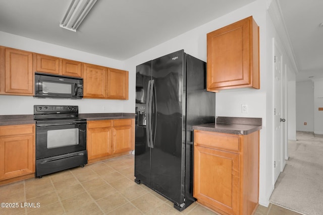 kitchen featuring light carpet and black appliances