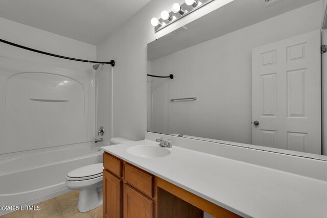 full bathroom with vanity, bathtub / shower combination, tile patterned floors, and toilet