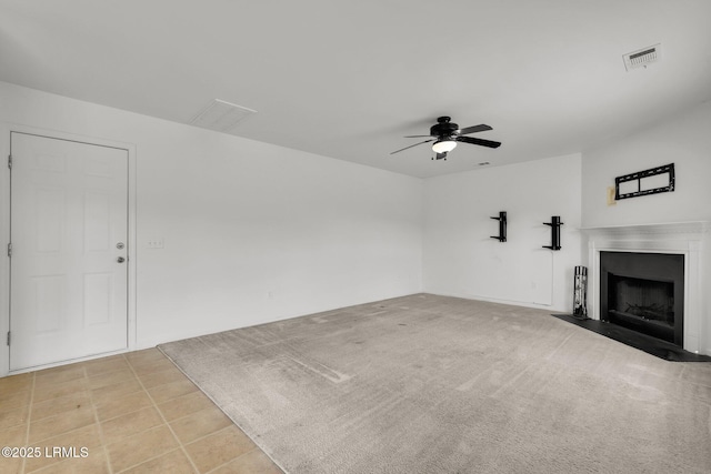 unfurnished living room featuring ceiling fan